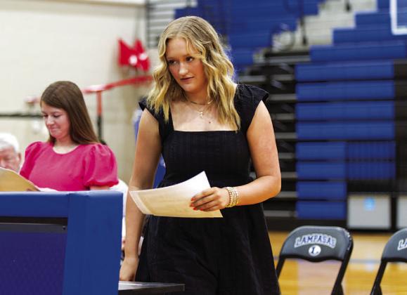 Keaton Owen walks to the front of the gym after receiving her recognition. HUNTER KING | DISPATCH RECORD