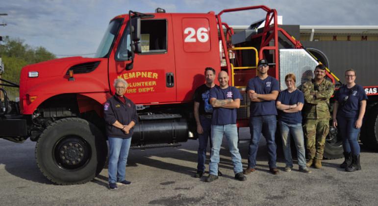 Kempner VFD Chief Connie Green stands at left, alongside Kempner volunteer firefighters, in front of the new brush truck the department received earlier this month. ERICK MITCHELL | DISPATCH RECORD