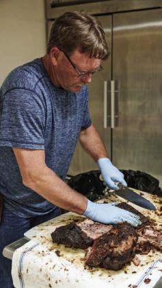 FILE PHOTO Kempner VFD Capt. Todd Burkett slices brisket at the 2023 Kempner VFD BBQ and Auction. Usually more than 300 people are served at the event.