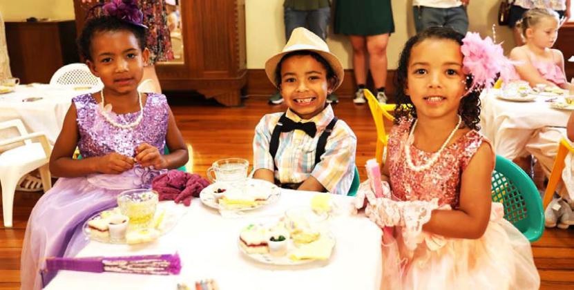 The Davises (from left to right) Silver, age 5, Ra’Nour, age 7, and Orchid, age 4, are dressed in their finest attire from gloves to hats to polished shoes. The siblings enjoyed “tea,” an assortment of finger sandwiches and cookies at this year’s Teddy Bear Tea. JOYCESARAH MCCABE | DISPATCH RECORD