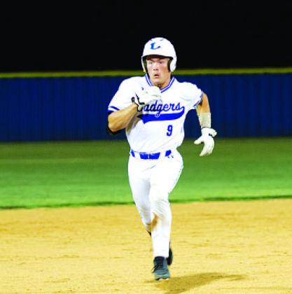 Corbin Kepler races to third base late in last Friday’s game. HUNTER KING | DISPATCH RECORD