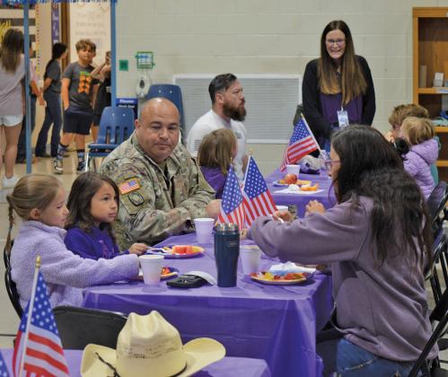 Hanna Springs students and their military family members enjoy a special breakfast Friday at the elementary school. erick mitchell | dispatch record