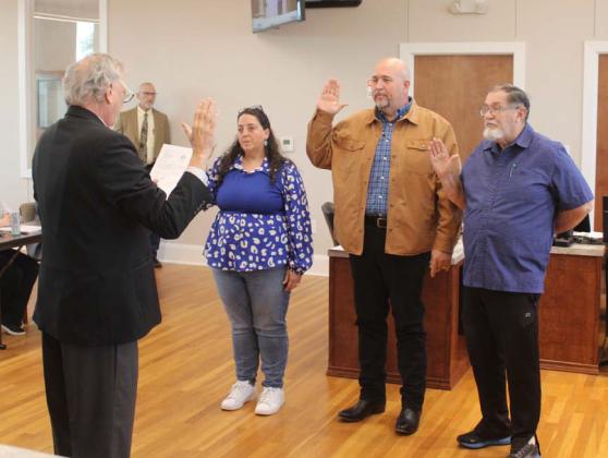At the May 13 Lampasas City Council meeting, Municipal Court Judge Robert Gradel administered the oath of office to re-elected members Catherine Kuehne, Davis Keele and Chuck Williamson, pictured left to right. courtesy photo | City of Lampasas