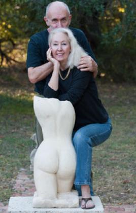 Pablo and Beverly Solomon pose with “Summer,” one of Pablo’s life-size sculptures in limestone. TK DESIGN AUSTIN