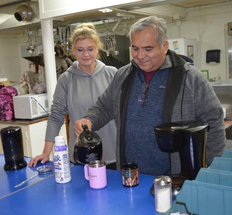 Sheriff Jess Ramos and his wife, Rebecca, serve coffee at St. Mary Catholic Church, which offered a warming station during single-digit temperatures. 