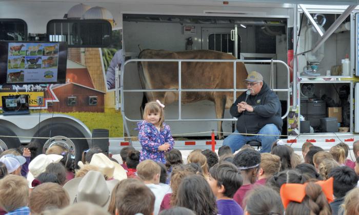 Lampasas Independent School District elementary school students listen to a lesson from a representative with the Southwest Dairy Farmers at its Mobile Dairy Classroom. ERICK MITCHELL | DISPATCH RECORD