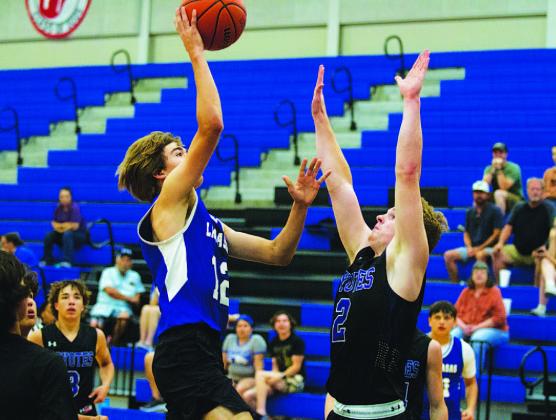 HUNTER KING | DISPATCH RECORD Jax Pratus tosses a floater toward the basket during last year’s summer league here in Lampasas.