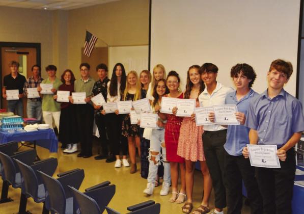 COURTESY PHOTO | KENNETH PEISER Badger tennis players show off their certificates from this week’s banquet.