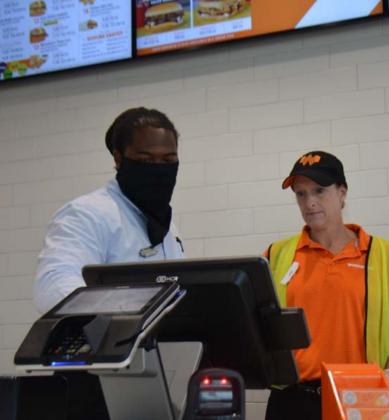 Since Whataburger opened its doors in Lampasas, the business has seen strong support from residents, customers and employees, according to lead manager Maurice Williamson, left. Pictured with him is employee Jodi Strickland. MONIQUE BRAND| DISPATCH RECORD