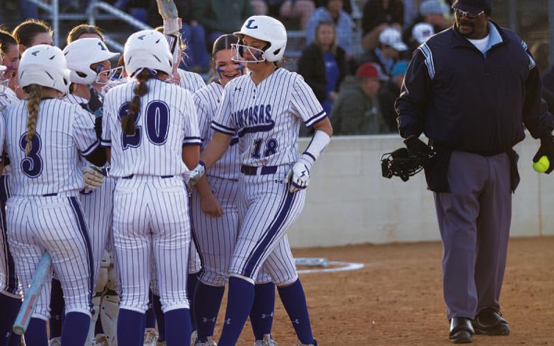 HUNTER KING | DISPATCH RECORD Madison Magilke steps on home plate after her three-run homer against Cedar Park on Monday.
