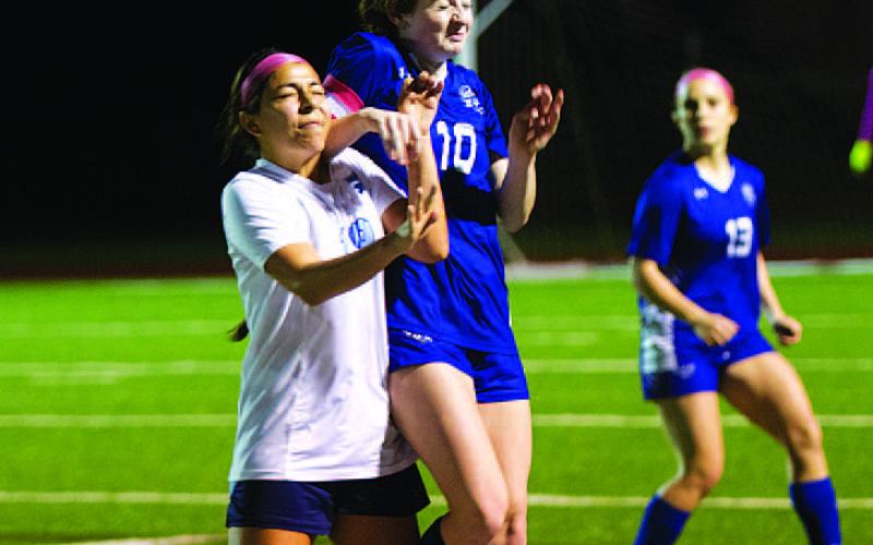 HUNTER KING | DISPATCH RECORD Kelbie Black battles for a header during the first half of last Friday’s match.