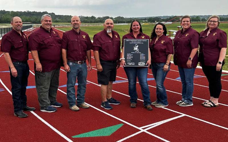 Celebrating the completion of the track facility at Lometa High School are, from left, Superintendent Rob Moore, and trustees John Hines, Matt Molter, Mario Maldonado, Amanda Tower, Megan Lusty, Cristopher Brister and Courtney Duncan. Courtesy photo