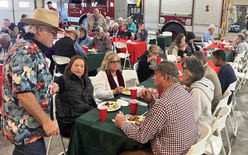 Attendees enjoy their food during the annual holiday luncheon sponsored by the Lampasas Police Department and fire department. Approximately $4,700 was raised at the luncheon to help provide toys to 300-350 children in the community. courtesy photo | Lampasas Fire Department
