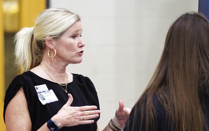 Annie Trotter, a representative of First Texas Bank of Lampasas, talks with Lampasas High School students about careers in finance and banking. HUNTER KING | DISPATCH RECORD