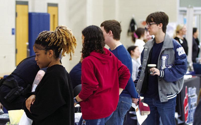 HUNTER KING | DISPATCH RECORD Lampasas High School students peruse information tables at the annual LHS Job Fair on Wednesday.