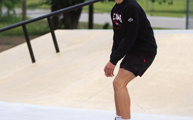 Cameron Jackson skates down a ramp last Saturday. HUNTER KING | DISPATCH RECORD