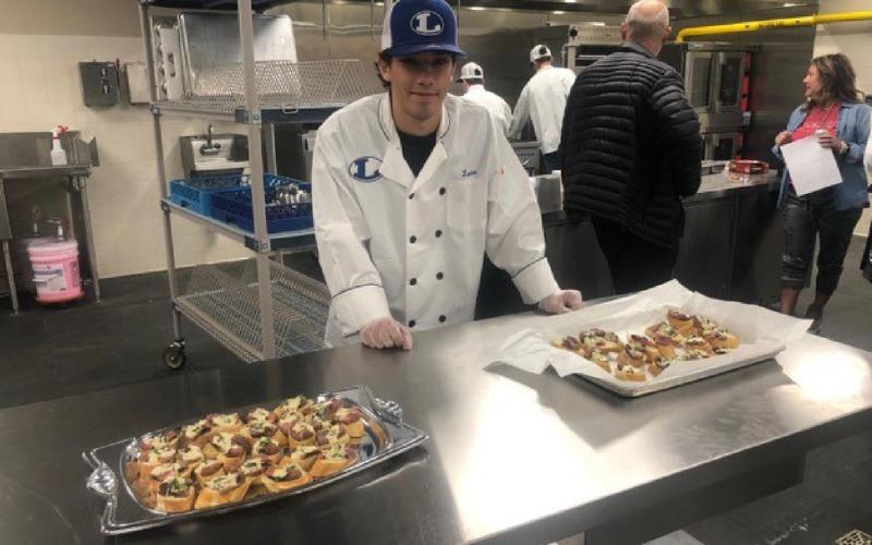 Culinary student Landon DiBattiste shows off his dish for competition. COURTESY PHOTO