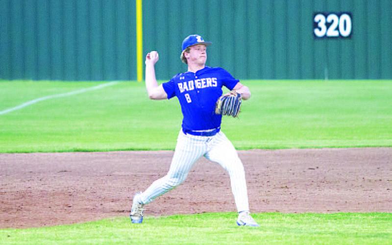 Cayhil Isom loads up and makes a throw across the diamond to first base. HUNTER KING | DISPATCH RECORD