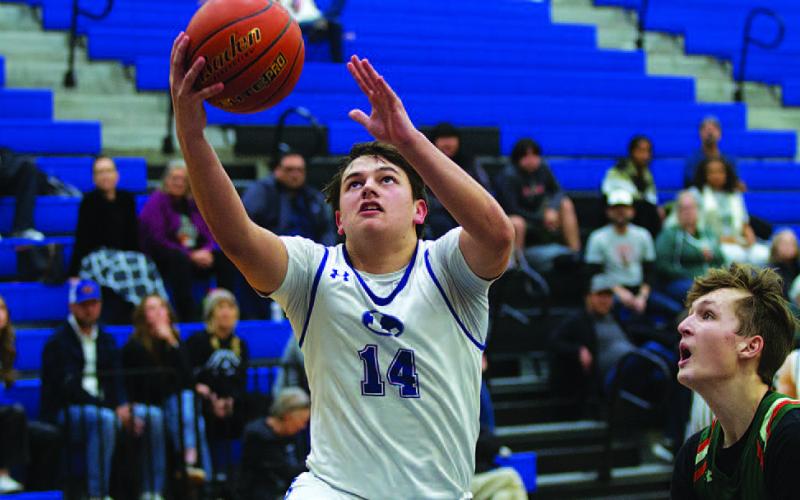 HUNTER KING | DISPATCH RECORD Dylan Polmanteer finishes a fast-break layup during the first half of this week’s game.