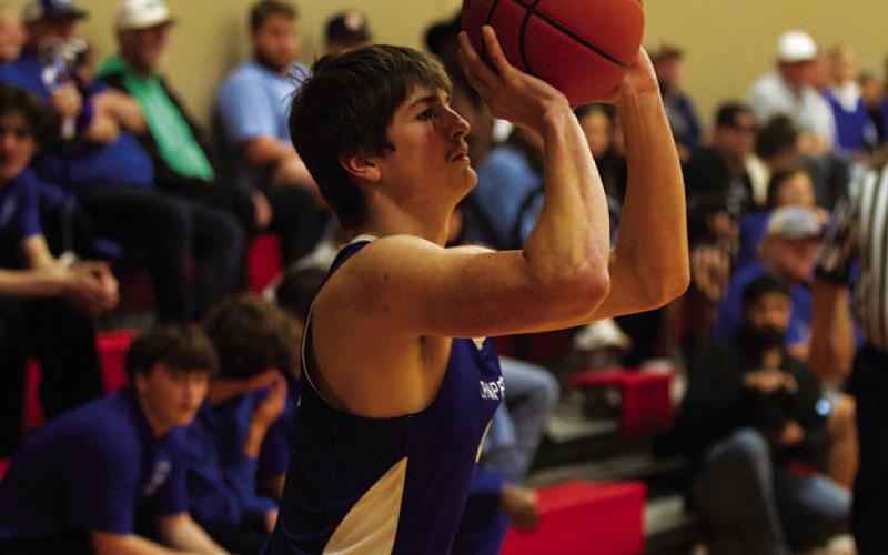 HUNTER KING | DISPATCH RECORD Calum Mitchell shoots a three-point shot during last week’s district contest.