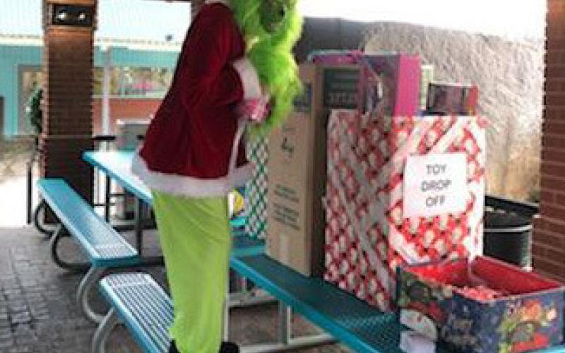 The Grinch also sneaked into the recent “Santa at Storm’s toy drive” event on Dec. 7 and attempted to make a getaway with the gifts. Unwrapped toys were collected for the Lampasas Fire Department’s annual distribution before Christmas. courtesy photo