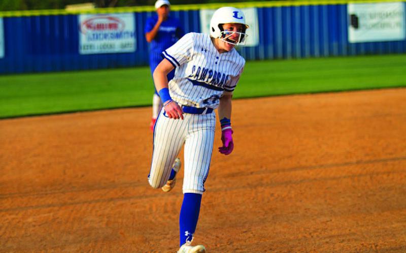 Aspen Wheeler heads home after hitting a grand slam on Senior Night that brought the game against Jarrell within one run Tuesday night. HUNTER KING | DISPATCH RECORD