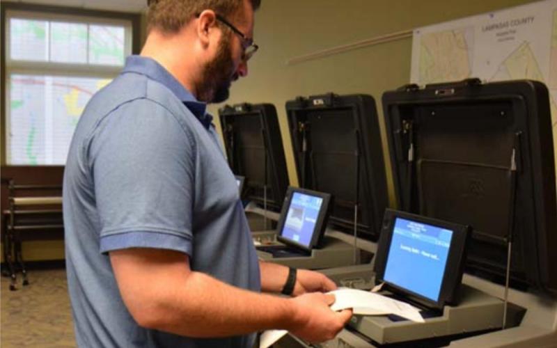 Kempner City Manager David Williams participates in the testing of election tabulating equipment Friday at the Lampasas County Office Building in downtown Lampasas. MONIQUE BRAND | DISPATCH RECORD