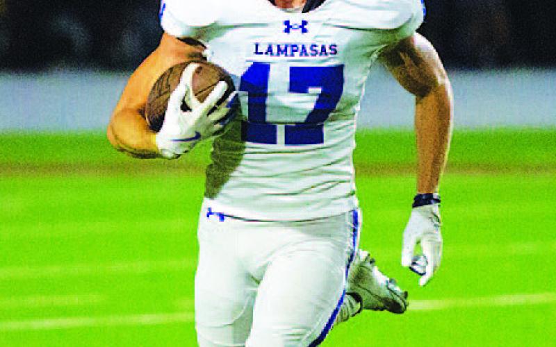 Sean Smith returns one of the Badgers’ three interceptions. HUNTER KING | DISPATCH RECORD