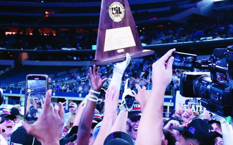 China Spring players hoist the State Champion trophy high, following their 24-21 comeback victory over Boerne. MASON HINES | DISPATCH RECORD