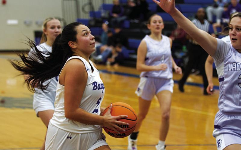 Johnnie Lewis drives to the basket for a layup against Florence. HUNTER KING | DISPATCH RECORD