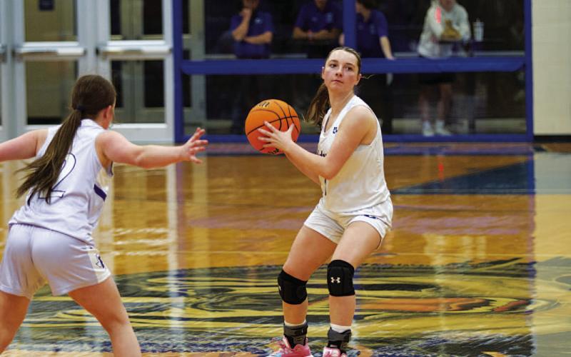 HUNTER KING | DISPATCH RECORD Abra White passes the ball to a teammate in the second half of the game.