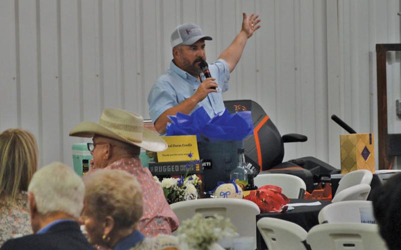 LCLA President Jeff Rutland welcomes guests to the 2024 LCLA Reverse Raffle before Saturday’s live auction. erick mitchell | dispatch record