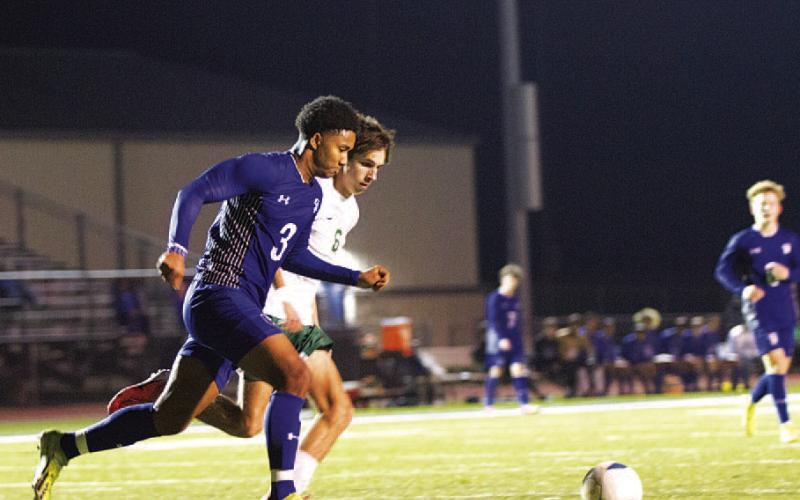 HUNTER KING | DISPATCH RECORD Josiah Toeaina races to clear a ball against the Bees.