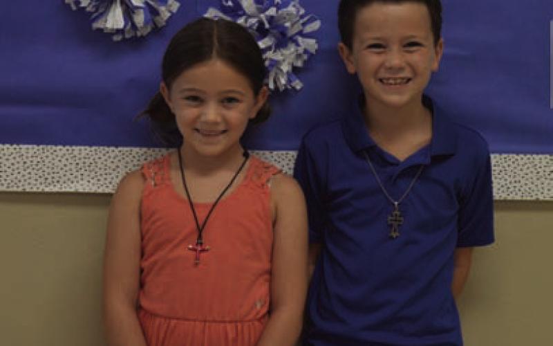 Raegan and Ashton Davis are such a close pair, Raegan helps clean her brother’s room. ERICK MITCHELL | DISPATCH RECORD