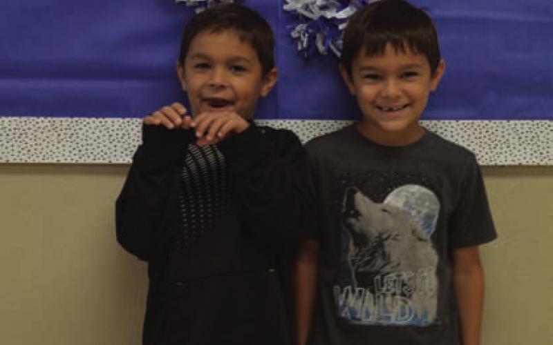 At left, Nickali and Josiah Cantu plan on keeping a tight twinhood as they grow older. ERICK MITCHELL | DISPATCH RECORD