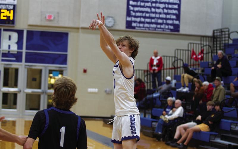 HUNTER KING | DISPATCH RECORD Peyton Sisson shoots over a Whitney defender. He scored 24 points in last Friday’s contest.
