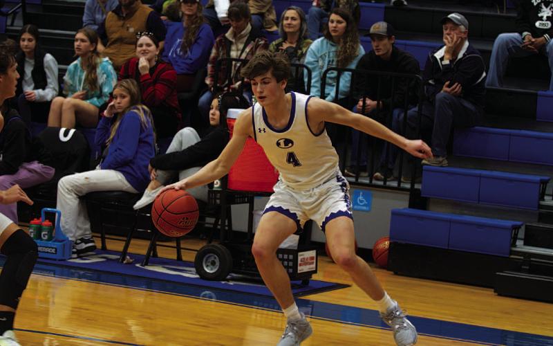 HUNTER KING | DISPATCH RECORD Calum Mitchell looks to drive the baseline during last week’s game.