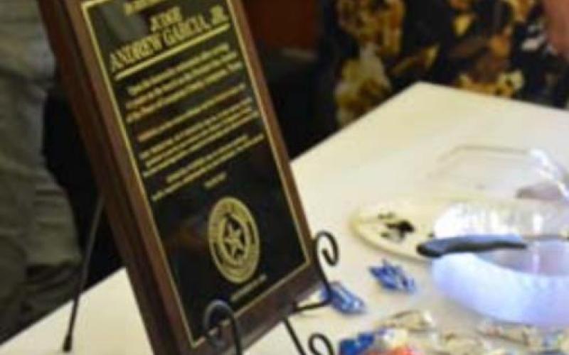 Garcia was honored with a plaque for his years in service with the county. MONIQUE BRAND | DISPATCH RECORD