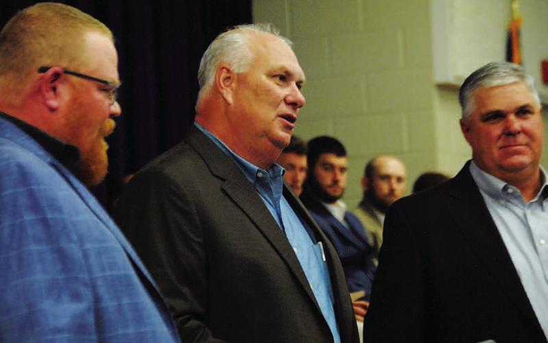 Curtis Thrift, center, was inducted into the hall of fame on Monday night. HUNTER KING | DISPATCH RECORD