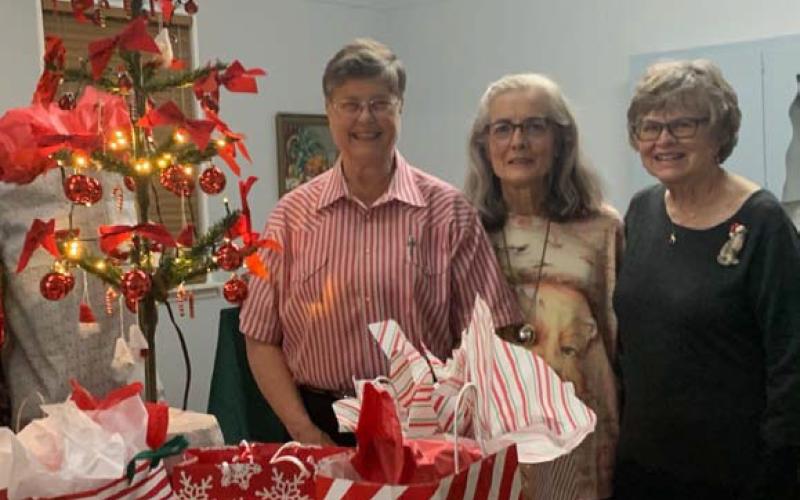Hostesses for the December garden club get-together were, from left, Sue Anderson, Tico Hicks and Lewvon Hicks. COURTESY PHOTO