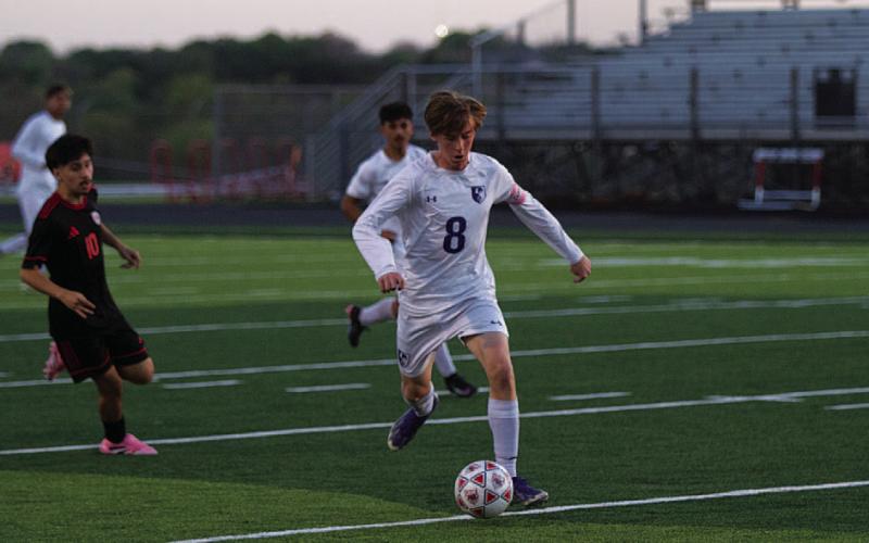 HUNTER KING | DISPATCH RECORD Parker Boykin prepares to make a pass from the midfield.