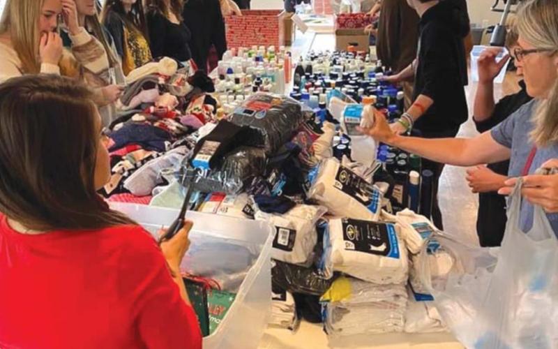 Students help assemble gift bags for distribution across Lampasas County. courtesy photo