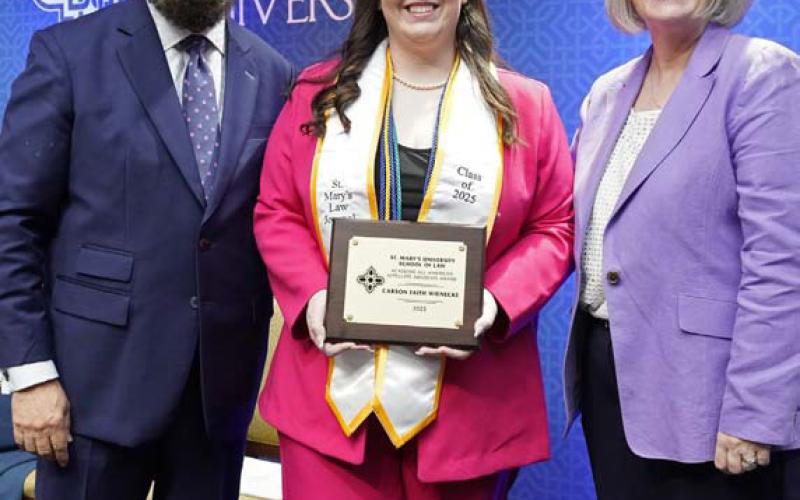 Recent St. Mary’s University School of Law graduate Carson Faith Wienecke of Lometa, center, was named a 2025 All-American Appellate Advocate by the National Association of Legal Advocacy, the first recipient in the law school’s history and one of only 20 awarded nationally. Pictured with her are A.J. Bellido de Luna, St. Mary’s University School of Law Assistant Dean for Advocacy and Conflict Resolution Programs, and St. Mary's School of Law Dean Patricia Roberts. COURTESY PHOTO