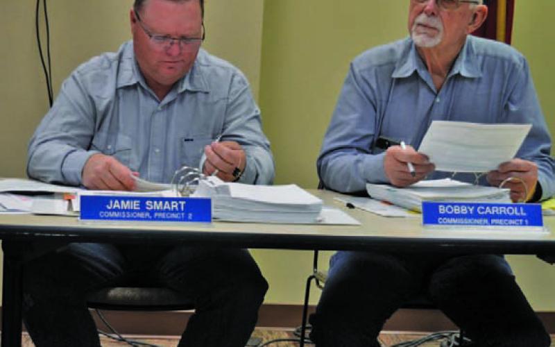 County Commissioners Jamie Smart, left, and Bobby Carroll were on different sides of a vote to rescind the outdoor burn ban. ERICK MITCHELL | DISPATCH RECORD