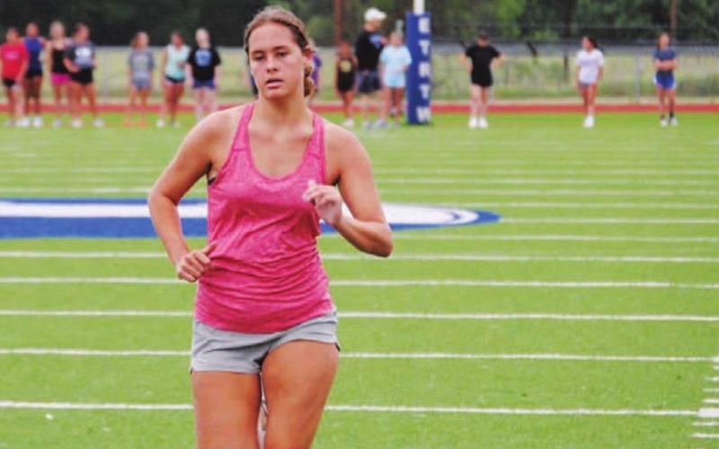 Jamie Ball finishes up a 100-yard sprint during the first day of SWAT. HUNTER KING | DISPATCH RECORD