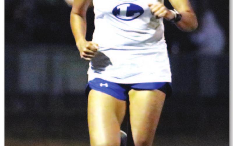 Leilany Alvarez jogs down the track during her long-distance run last Thursday in Llano. BRILEY MITCHELL | COURTESY PHOTO
