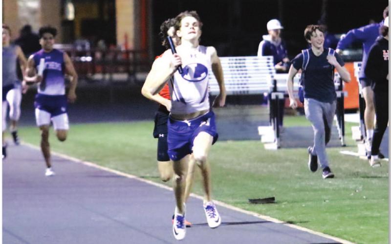 Nate Borchardt sprints to the finish line during a first-place finish for the Badgers’ mile relay team. BRILEY MITCHELL | COURTESY PHOTO