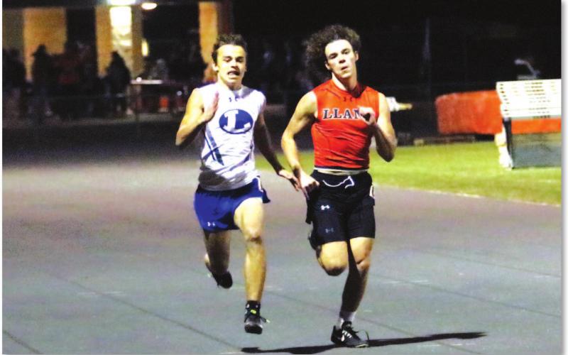 Wilson Hammond races against a Llano runner for placement during Thursday’s meet. BRILEY MITCHELL | COURTESY PHOTO