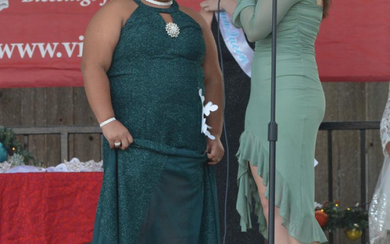 Vera-Rose Johnson, left, is pictured on the Lampasas County Courthouse bandstand in December after taking the Snow Queen title. She will comete in a state pageant this weekend, hosted by the National American Miss organization. file photo