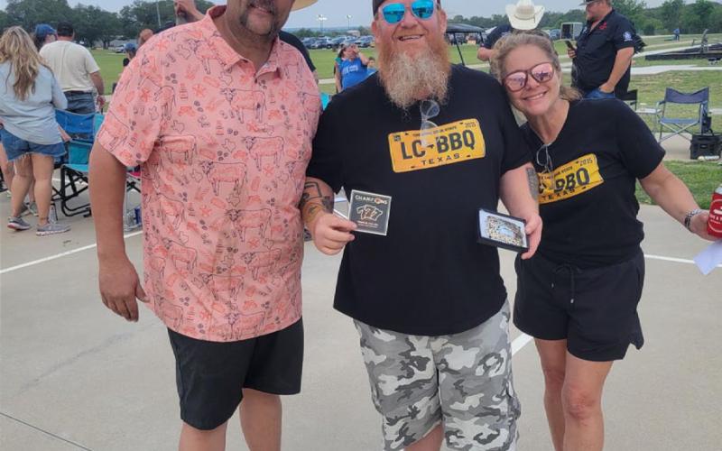 COURTESY PHOTO The LC BBQ cookers show off their prize after taking the grand champion honors at last weekend’s LTX BBQ cookoff event.